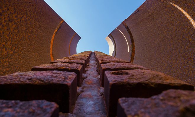 A corroded building from the ground, up