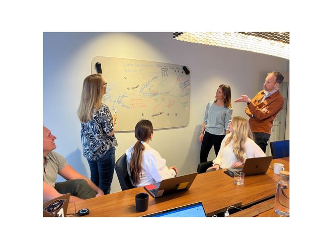 Ovako employees in an office setting discussing CSRD