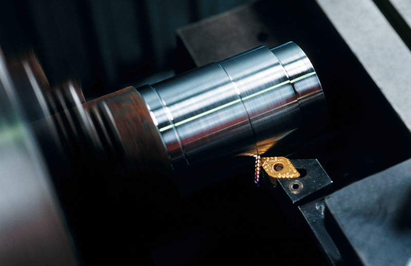 Machining a steel component, showing precision cutting in progress